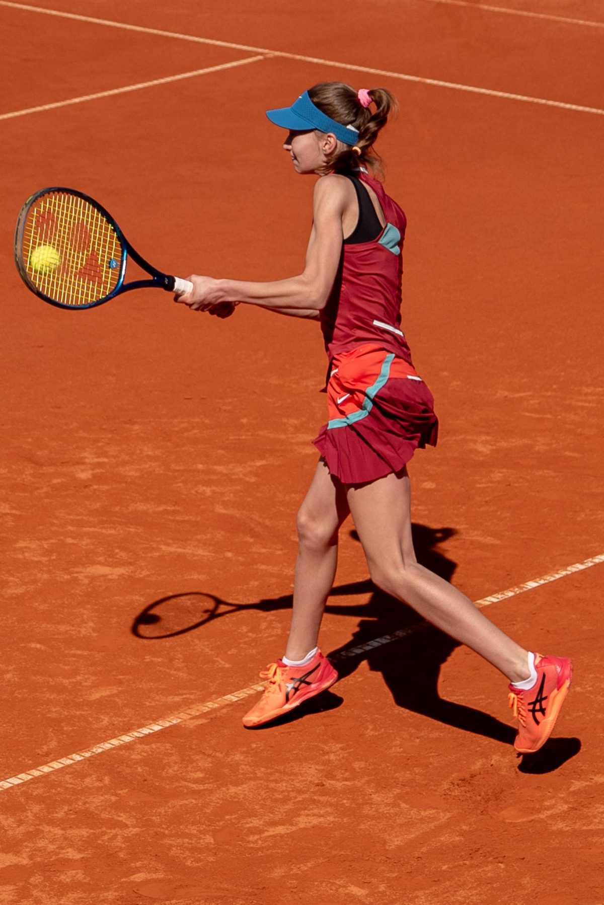 Girl playing tennis at the sunny tennis court at Ljubicic Tennis Academy