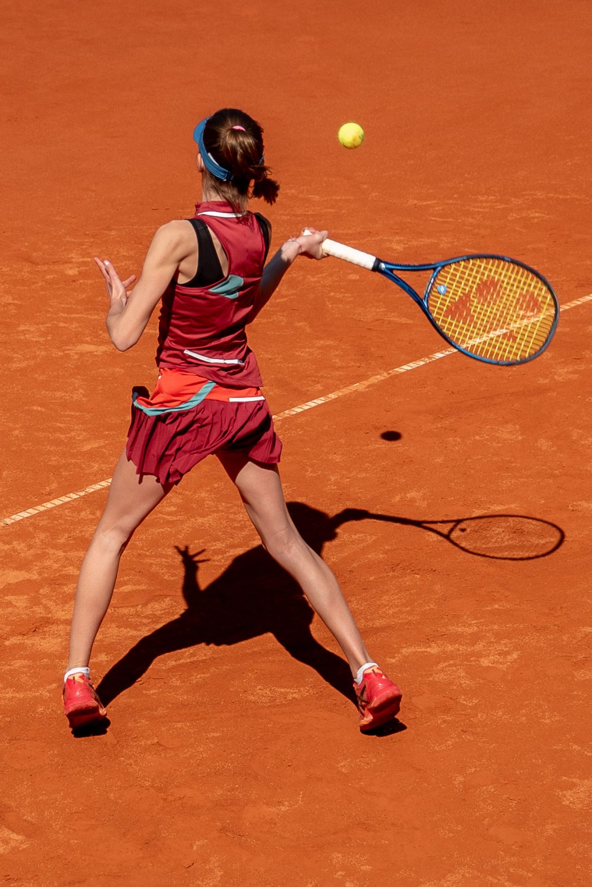 Girl playing tennis at the sunny tennis court at Ljubicic Tennis Academy